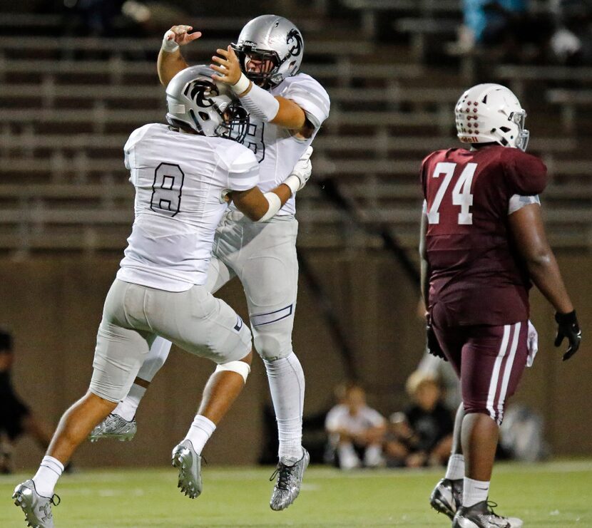 While Plano Senior High School offensive lineman Akanimoh Inyang (74) walks away, Denton...