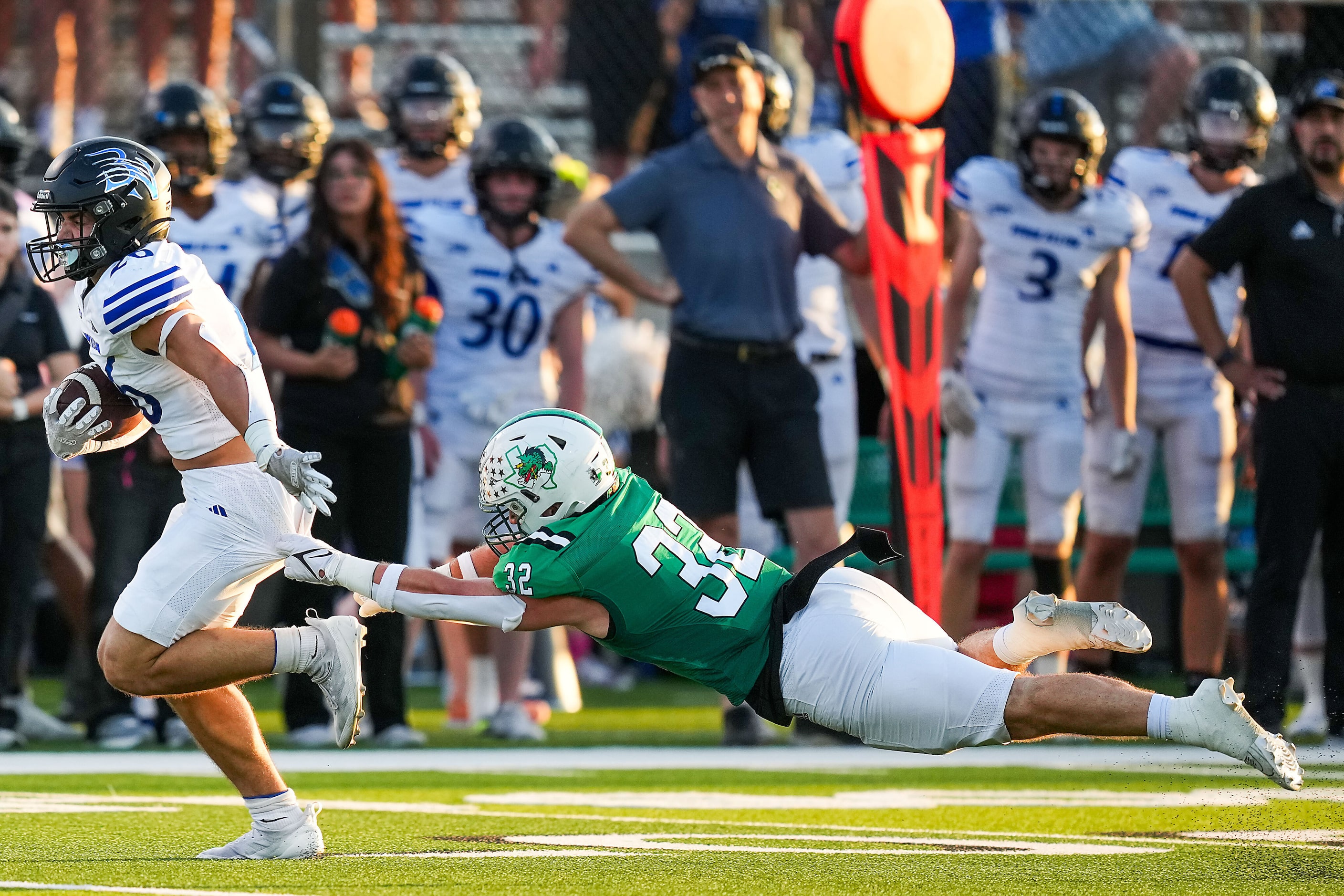 Trophy Club Byron Nelson running back  Tucker James (26) gets past Southlake Carroll...