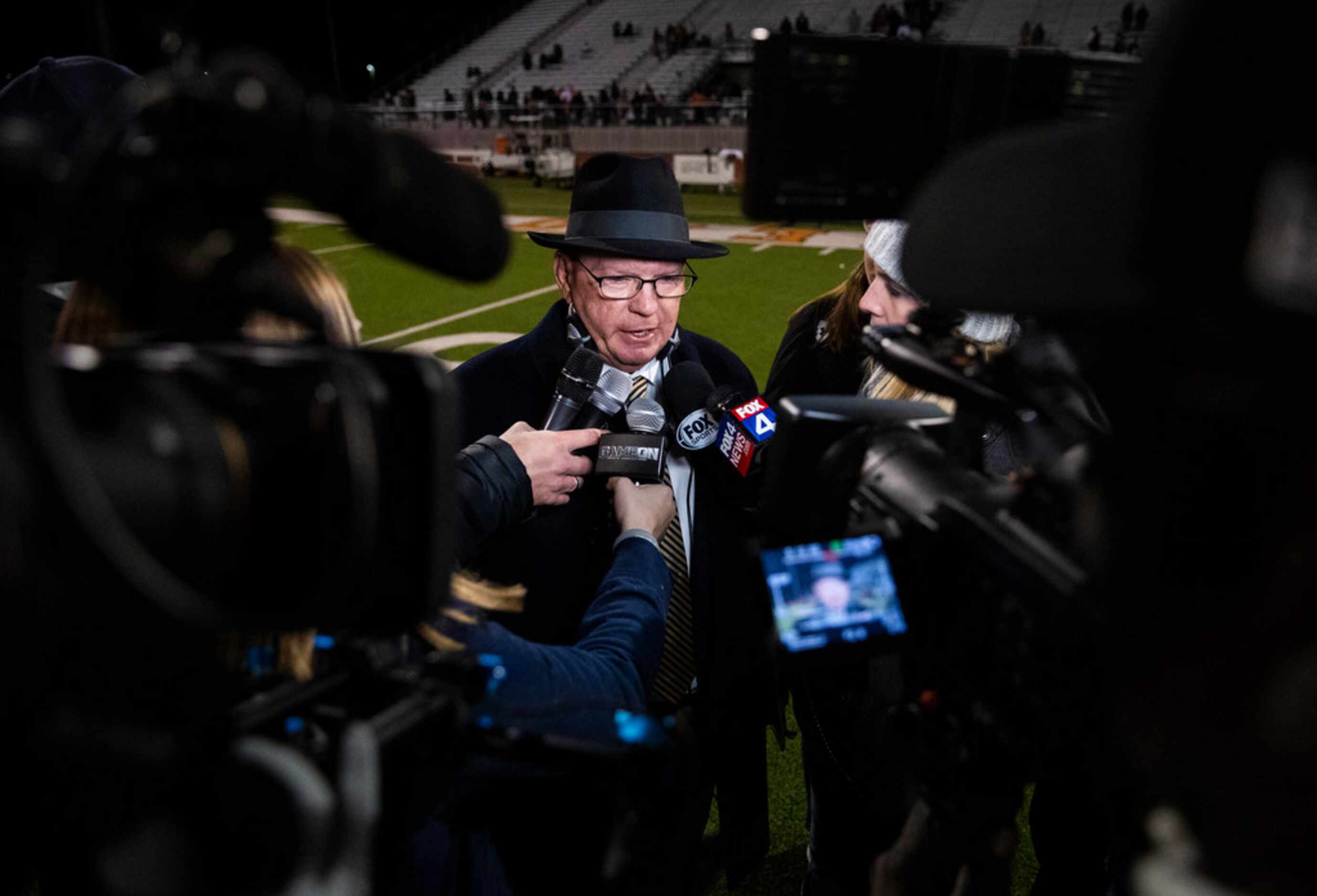 Highland Park head coach Randy Allen answers questions from reporters after a 42-35 win over...