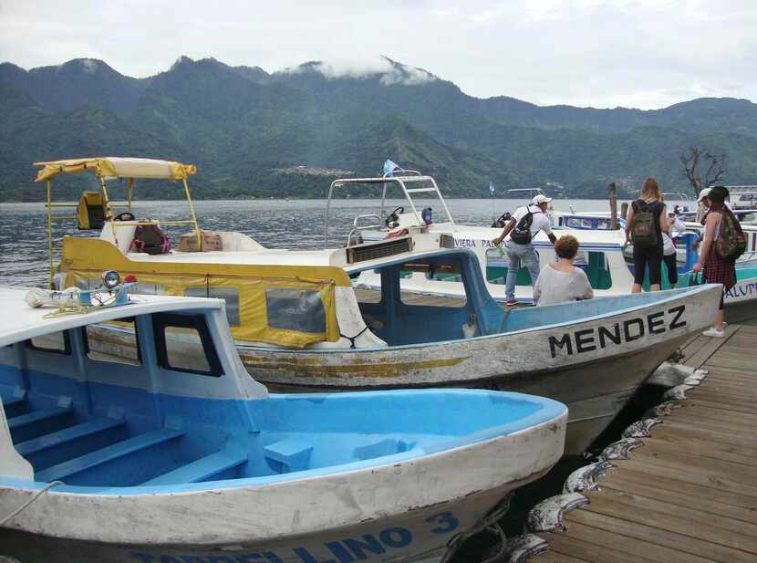 
Boats bob at the docks near San Pedro, one of a dozen villages ringing Lake Atitlán. The...