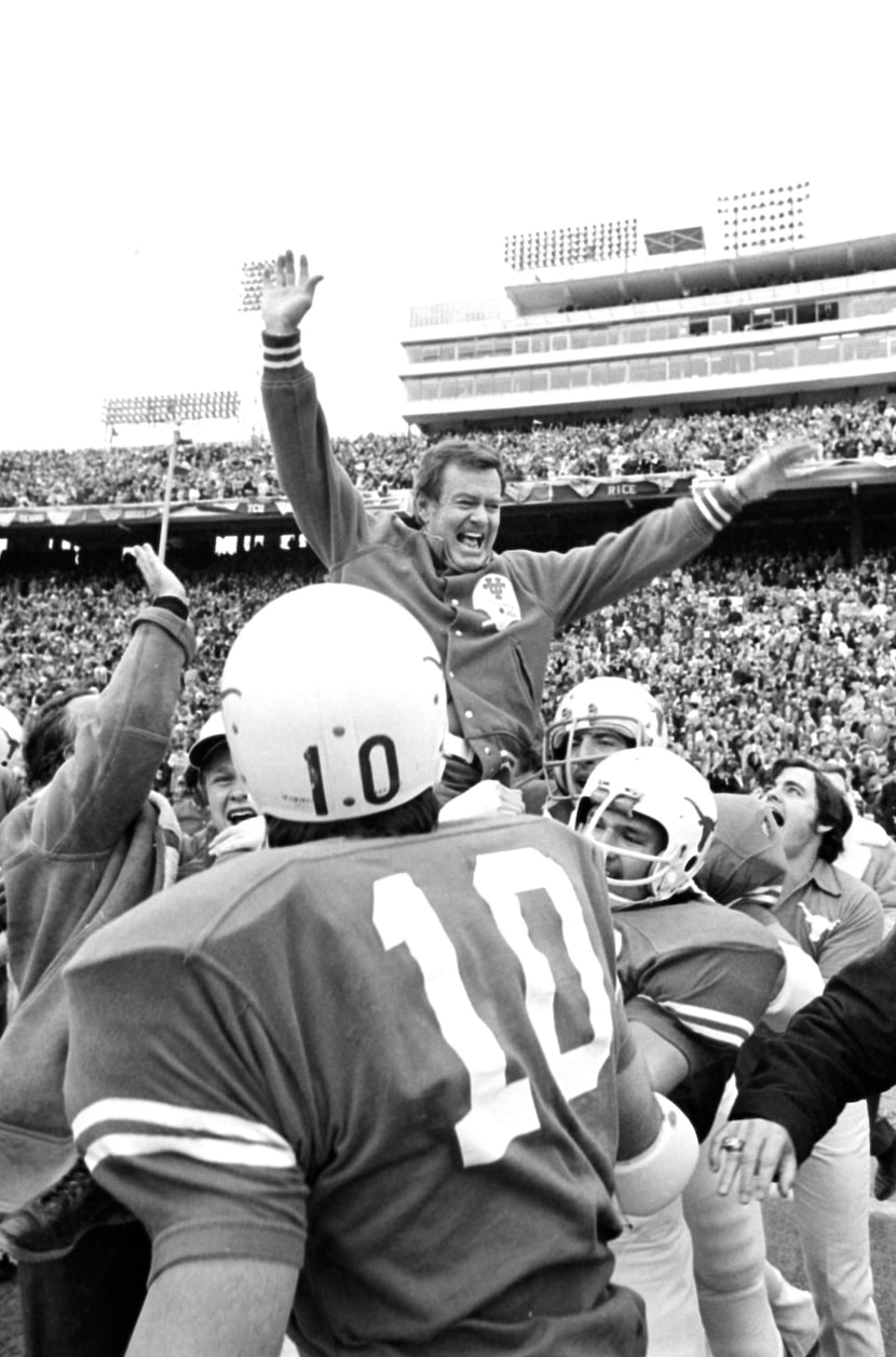 Texas coach Darrell Royal is carried off the field by his players after the Longhorns...