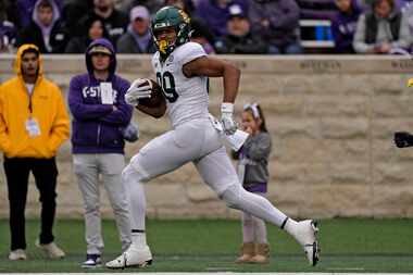 Baylor tight end Drake Dabney runs for a touchdown during the second half of an NCAA college...