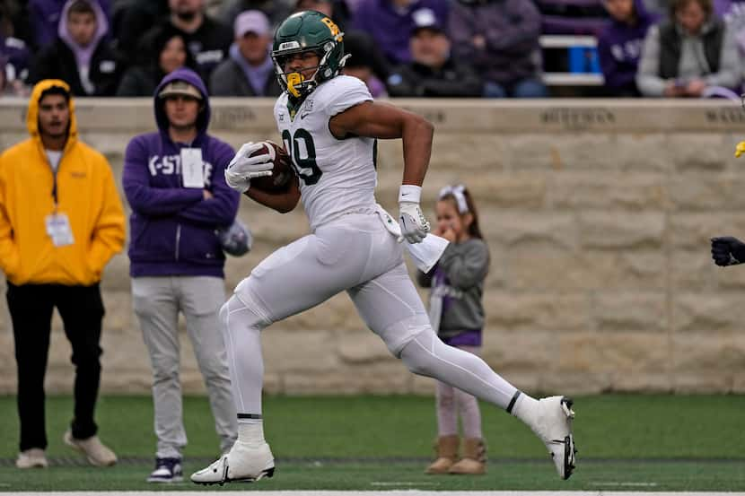 Baylor tight end Drake Dabney runs for a touchdown during the second half of an NCAA college...