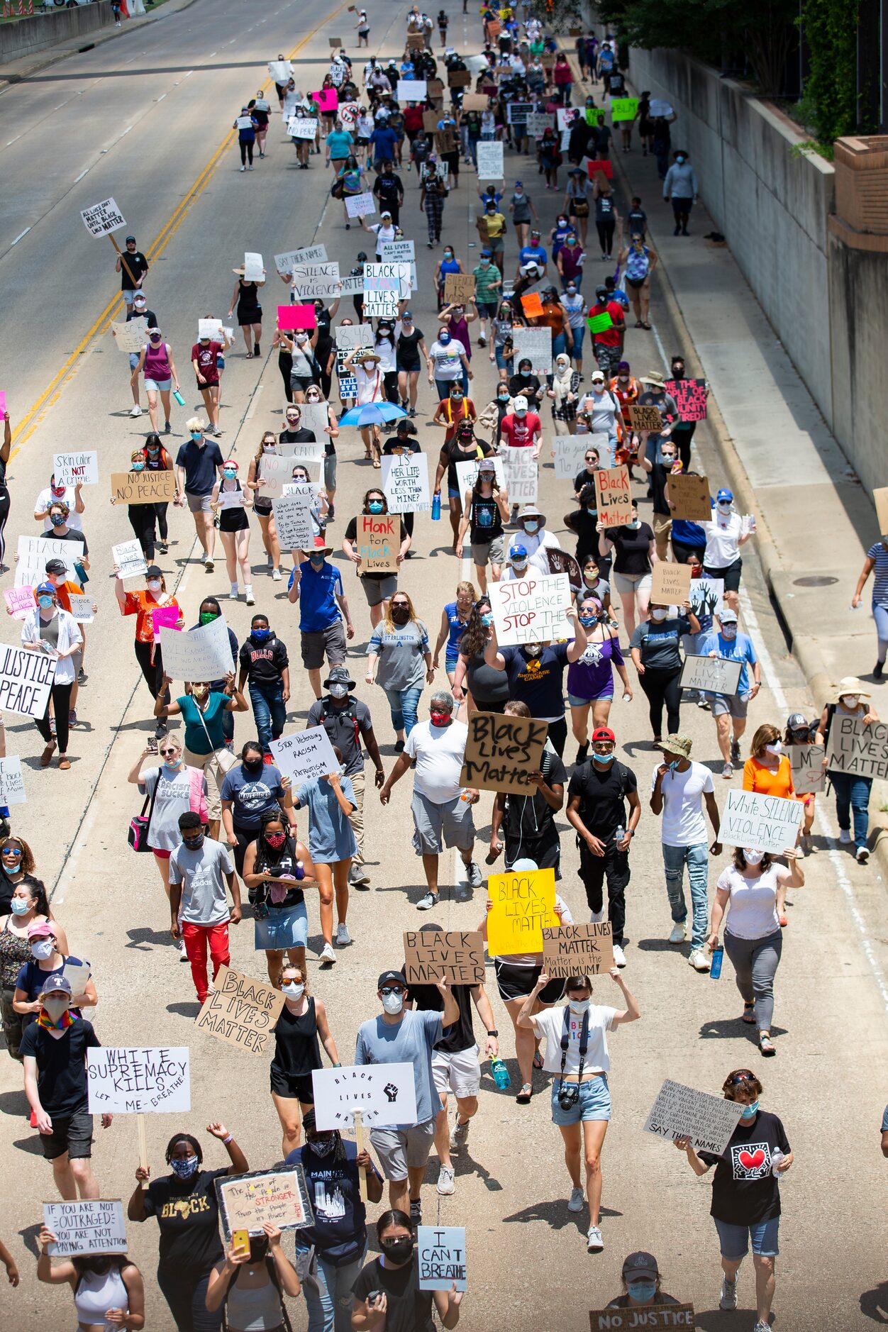 Protestors against police brutality march down S Cooper St as they participate in the UTA...