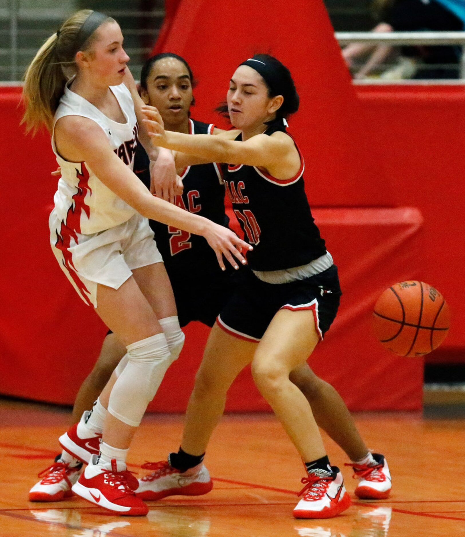 Flower Mound Marcus High School forward Olivia Fredrick (4) passes the basketball while...