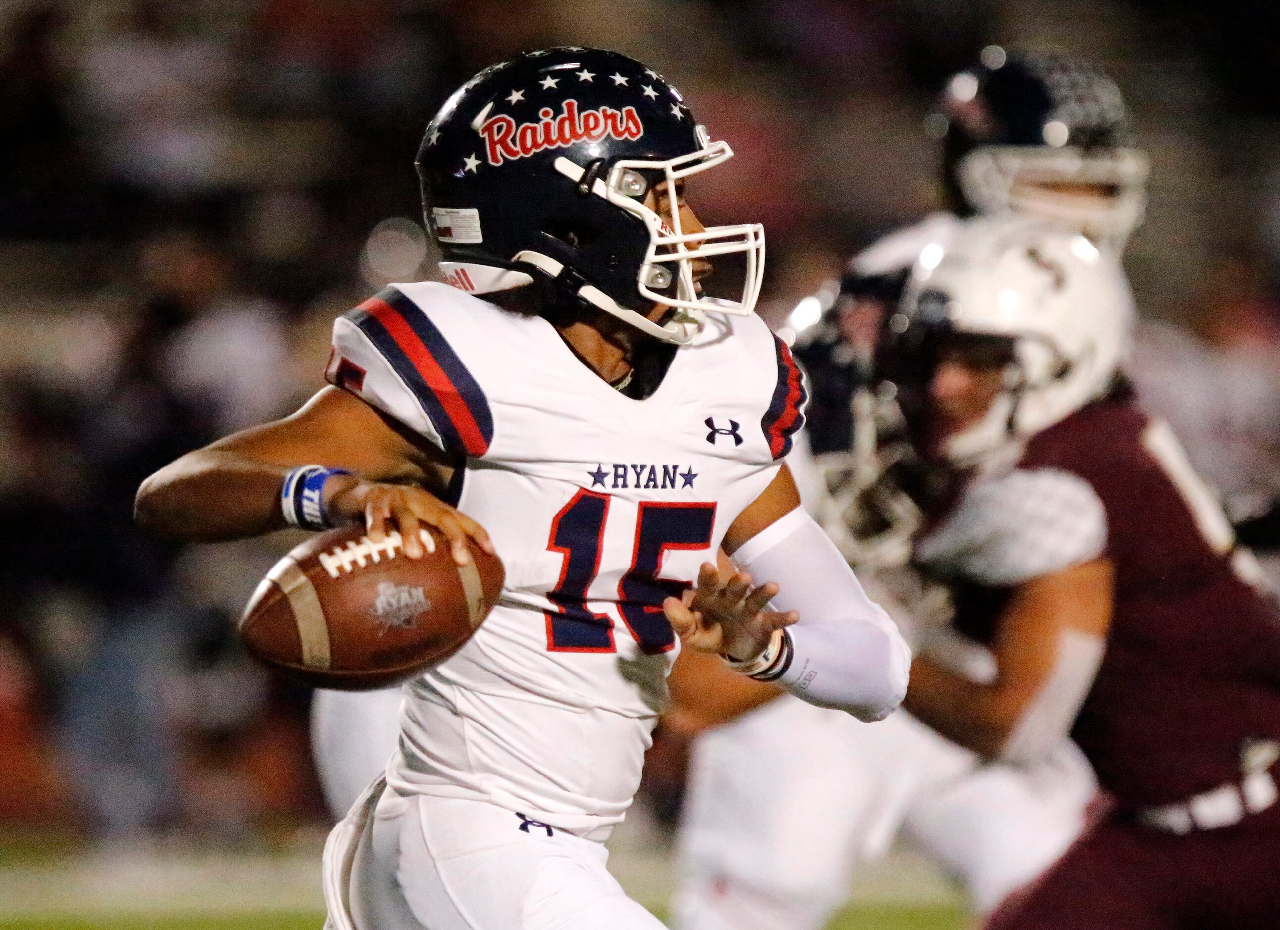 Denton Ryan High School quarterback Khalon Davis (15) throws a pass during the first half as...