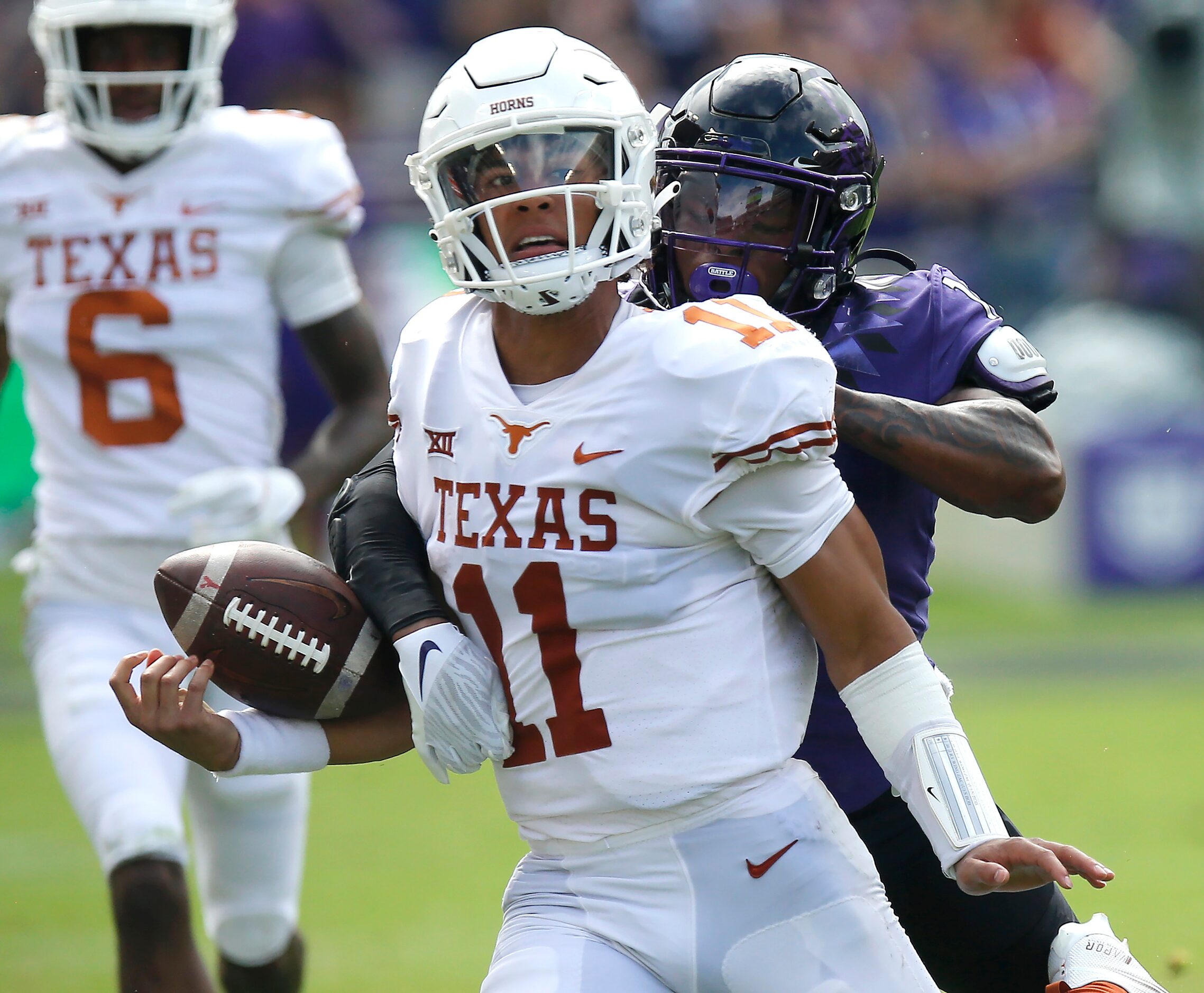 Texas Longhorns quarterback Casey Thompson (11) fumbles the ball out of bounds after a long...