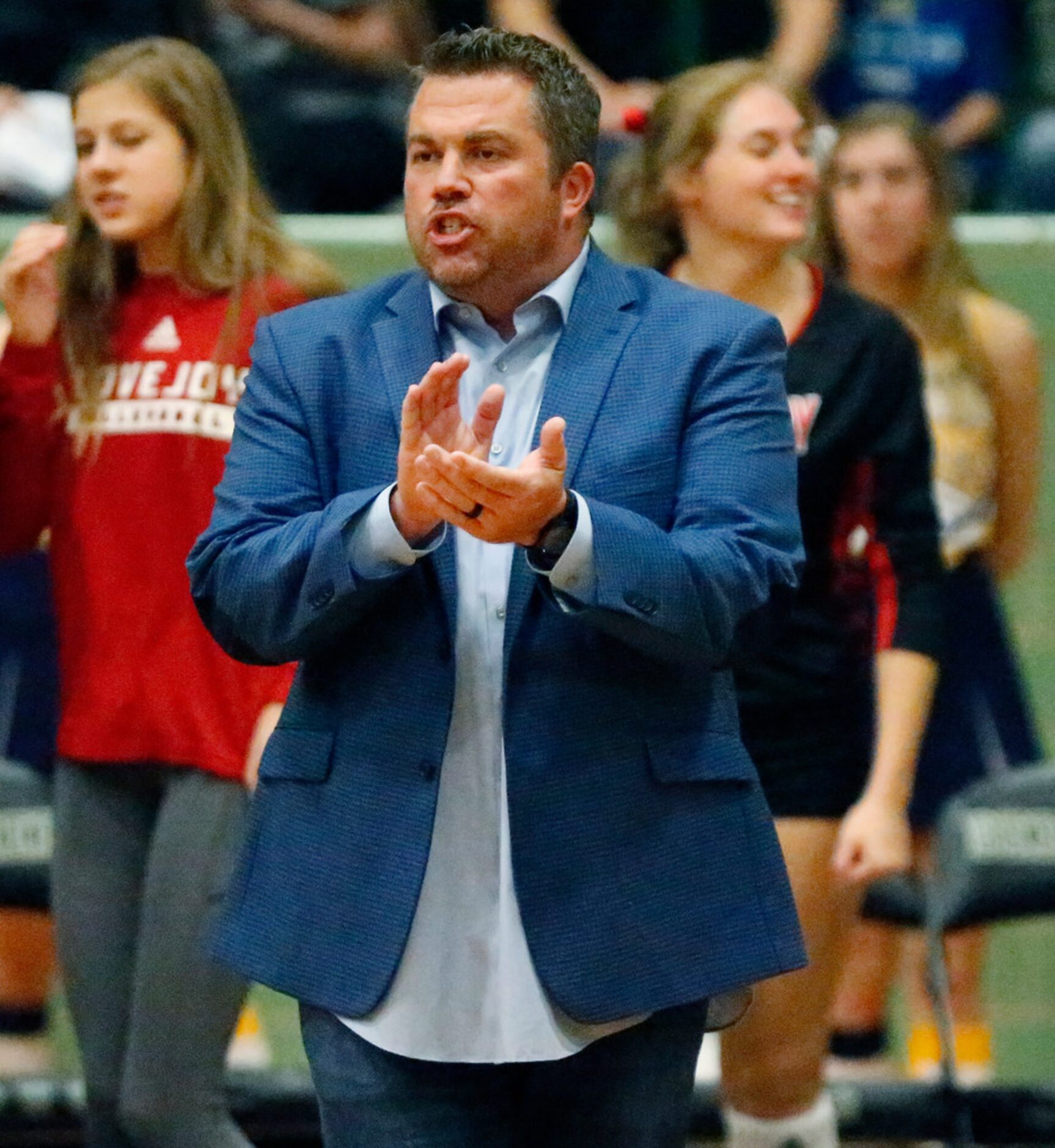 Lovejoy High School head coach Ryan Mitchell cheers his team on in game two as Lovejoy High...