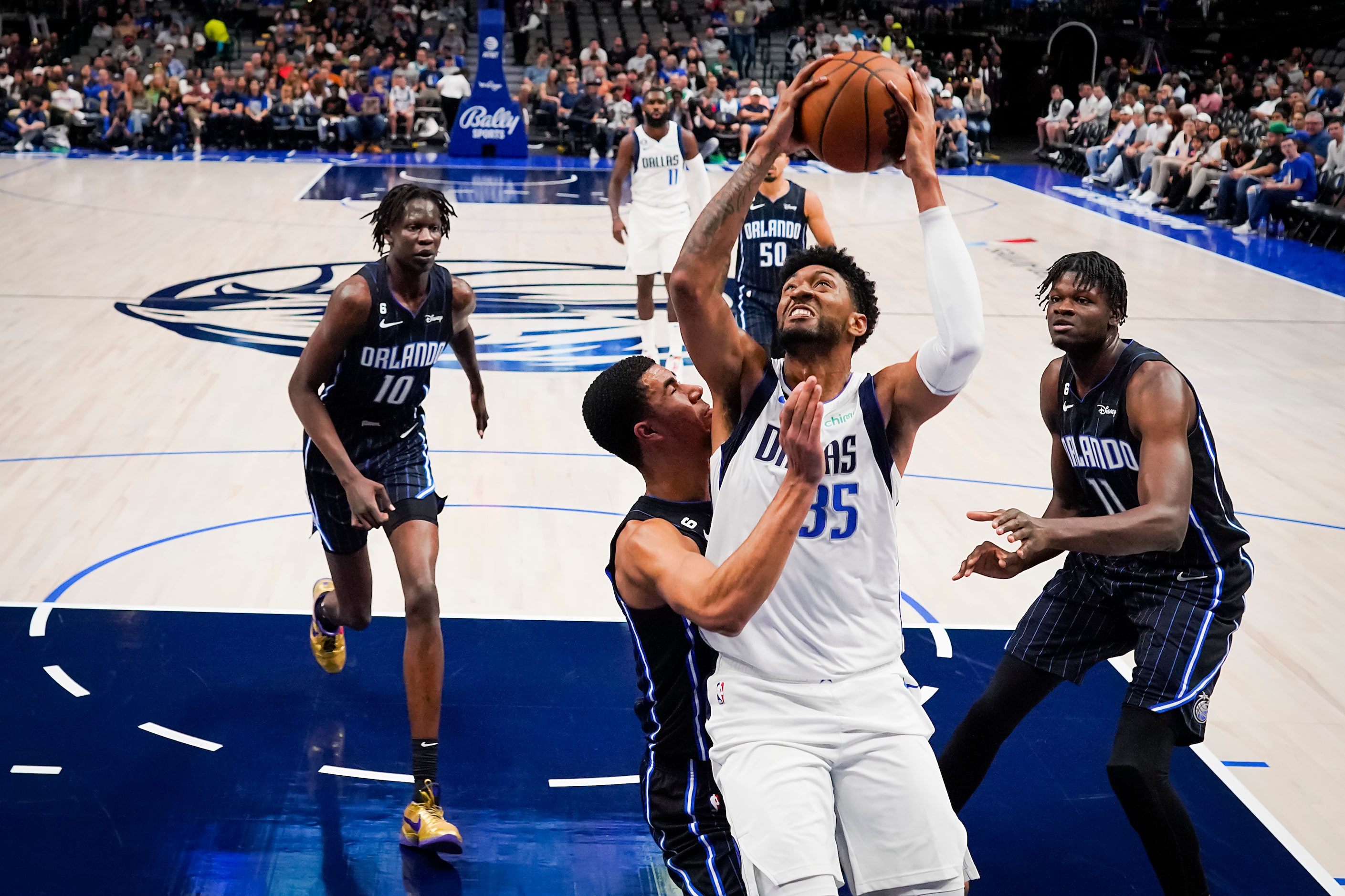 Dallas Mavericks center Christian Wood (35) drives to the basket during the first half of an...