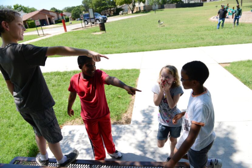 Neighborhood kids (from left) R.J. Jackson, 9, Jaelon Dennis, 9, Amie Jackson, 7, and Jaidon...