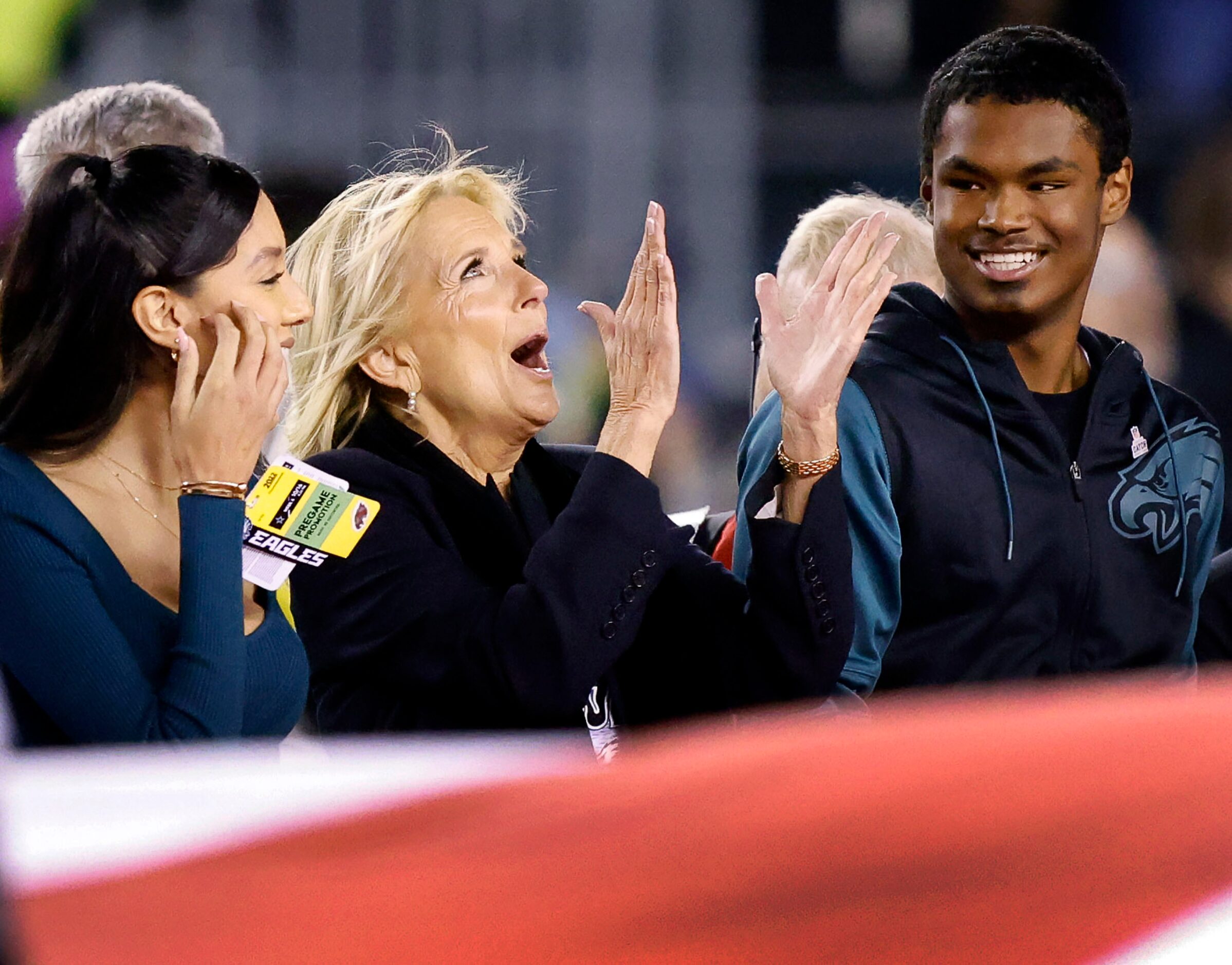 First Lady Dr. Jill Biden applauds after the singing of the national anthem before the...