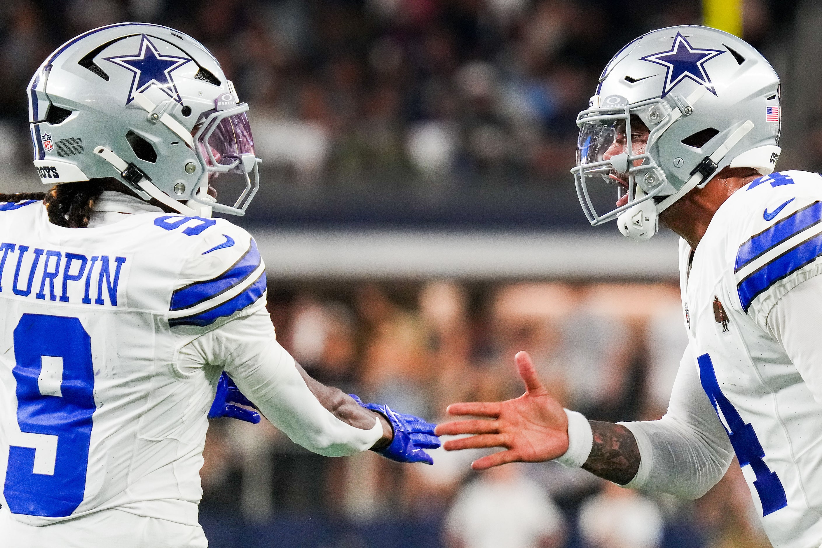 Dallas Cowboys wide receiver KaVontae Turpin (9) celebrates with quarterback Dak Prescott...