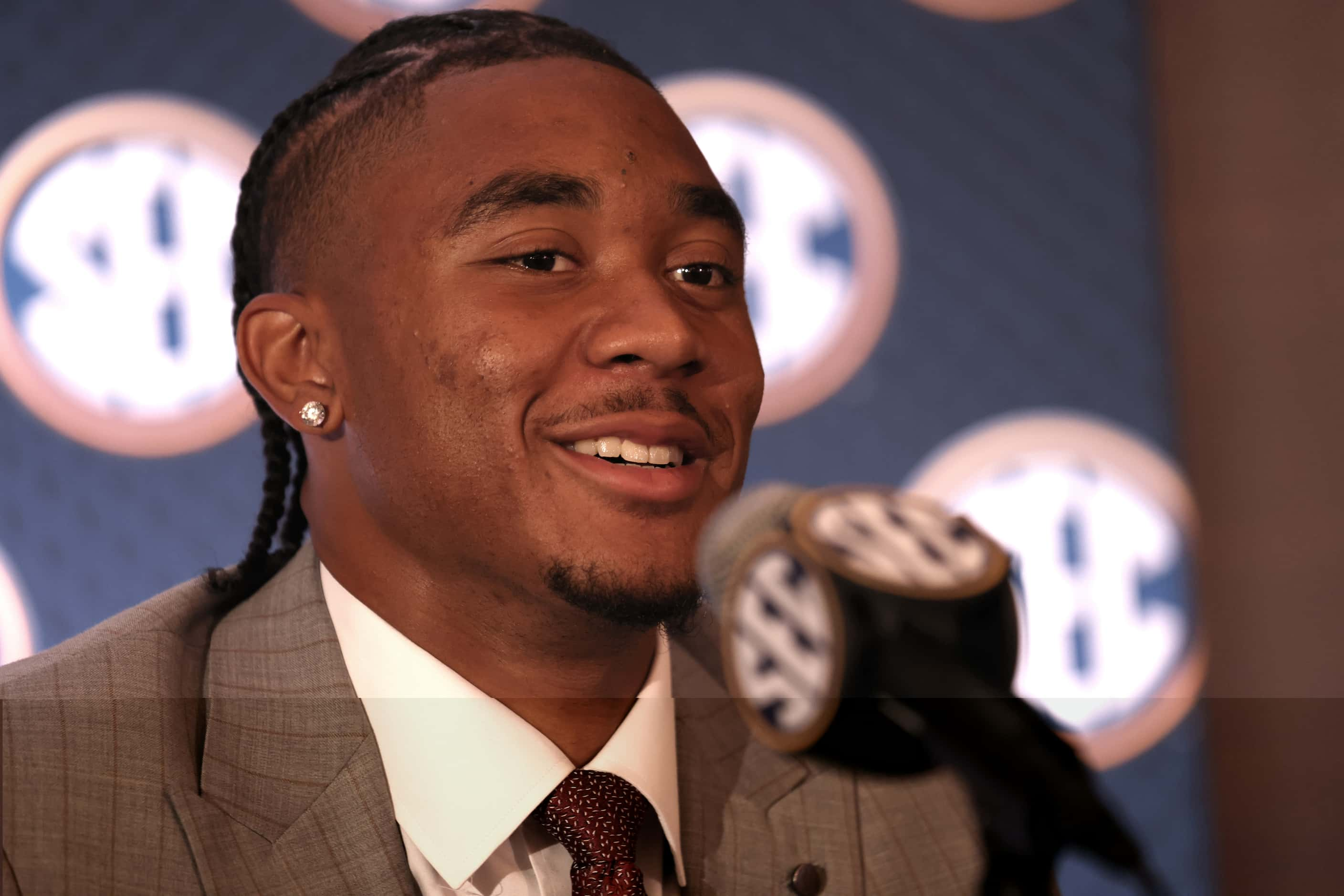 Arkansas quarterback Taylen Green converses with a media member during an interview session....