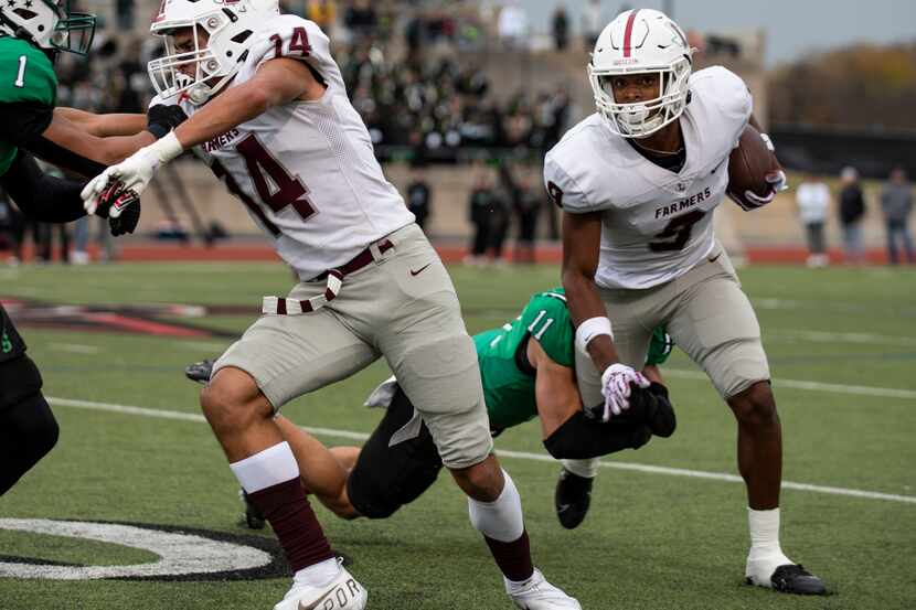 Lewisville senior Armani Winfield (9) is tackled by Southlake Carroll senior Josh Spaeth...