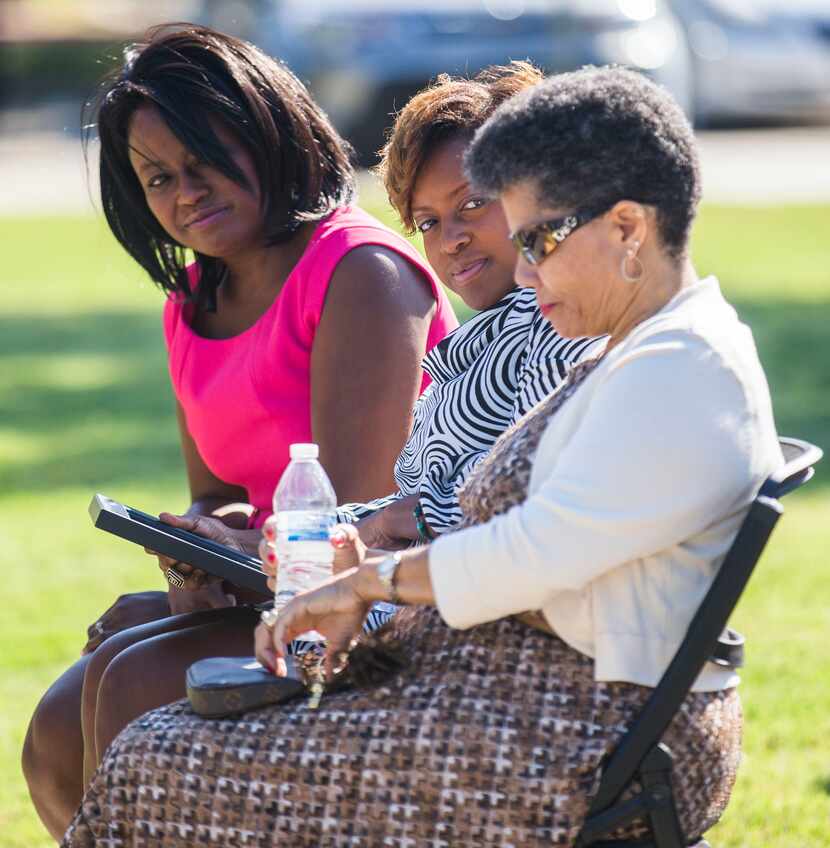 Dr. Carla Spann Lopez, left, and Gai Spann look at their mother, Gwenelle Johnson Spann,...