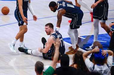 Dallas Mavericks guard Luka Doncic (77) reacts after being called for his sixth foul of the...