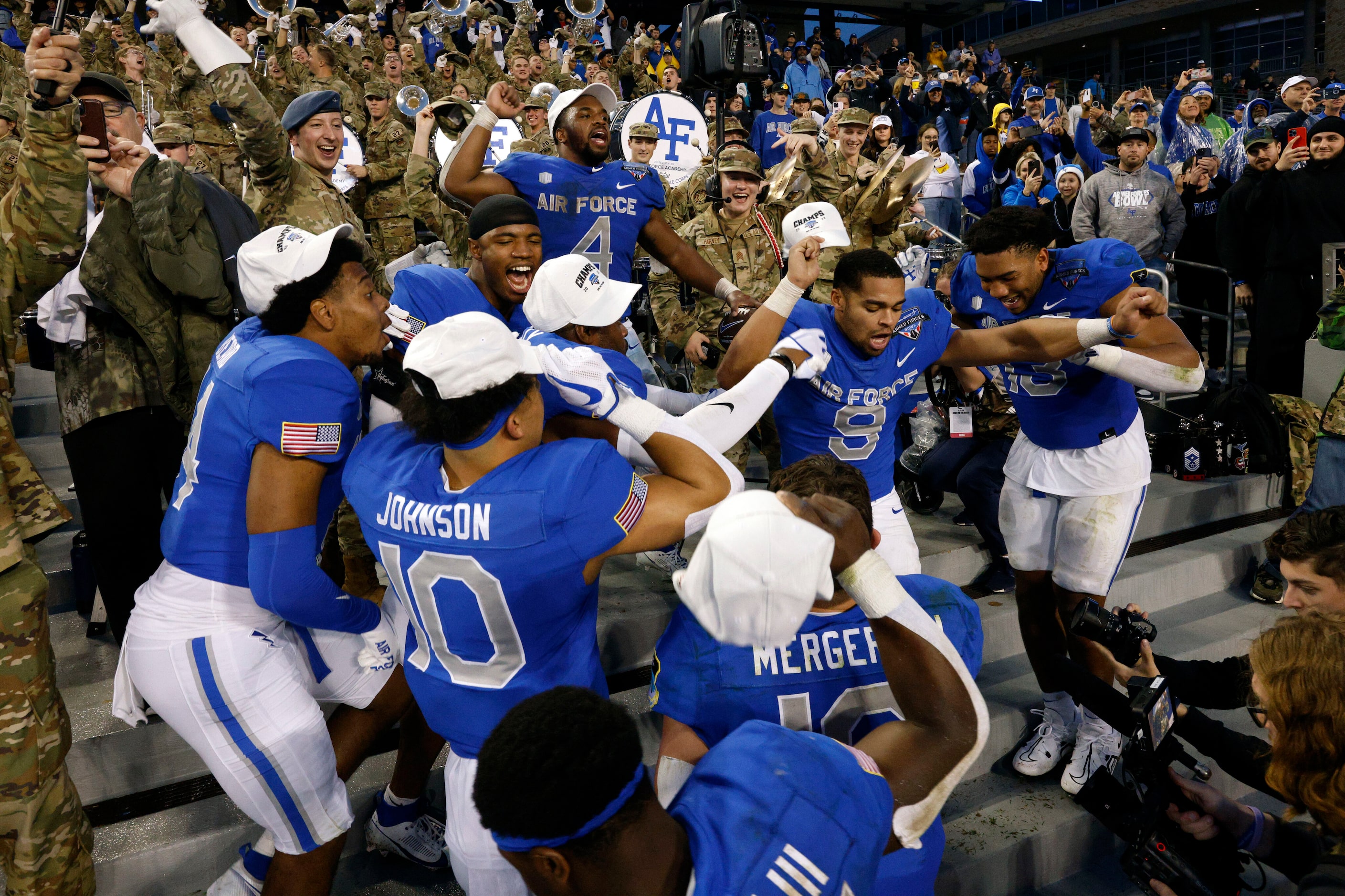 Air Force players dance as they celebrate winning the Armed Forces Bowl NCAA football game,...