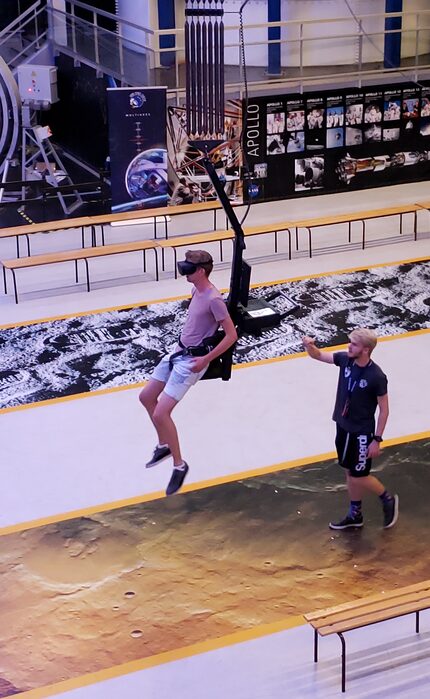 A guest at the Euro Space Center in Transinne, Belgium, tries out the Moonwalk/Marswalk...