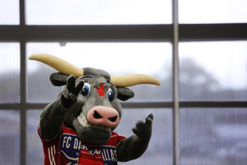 FC Dallas mascot Tex Hooper gestures during a dedication ceremony for new mobile carts for...