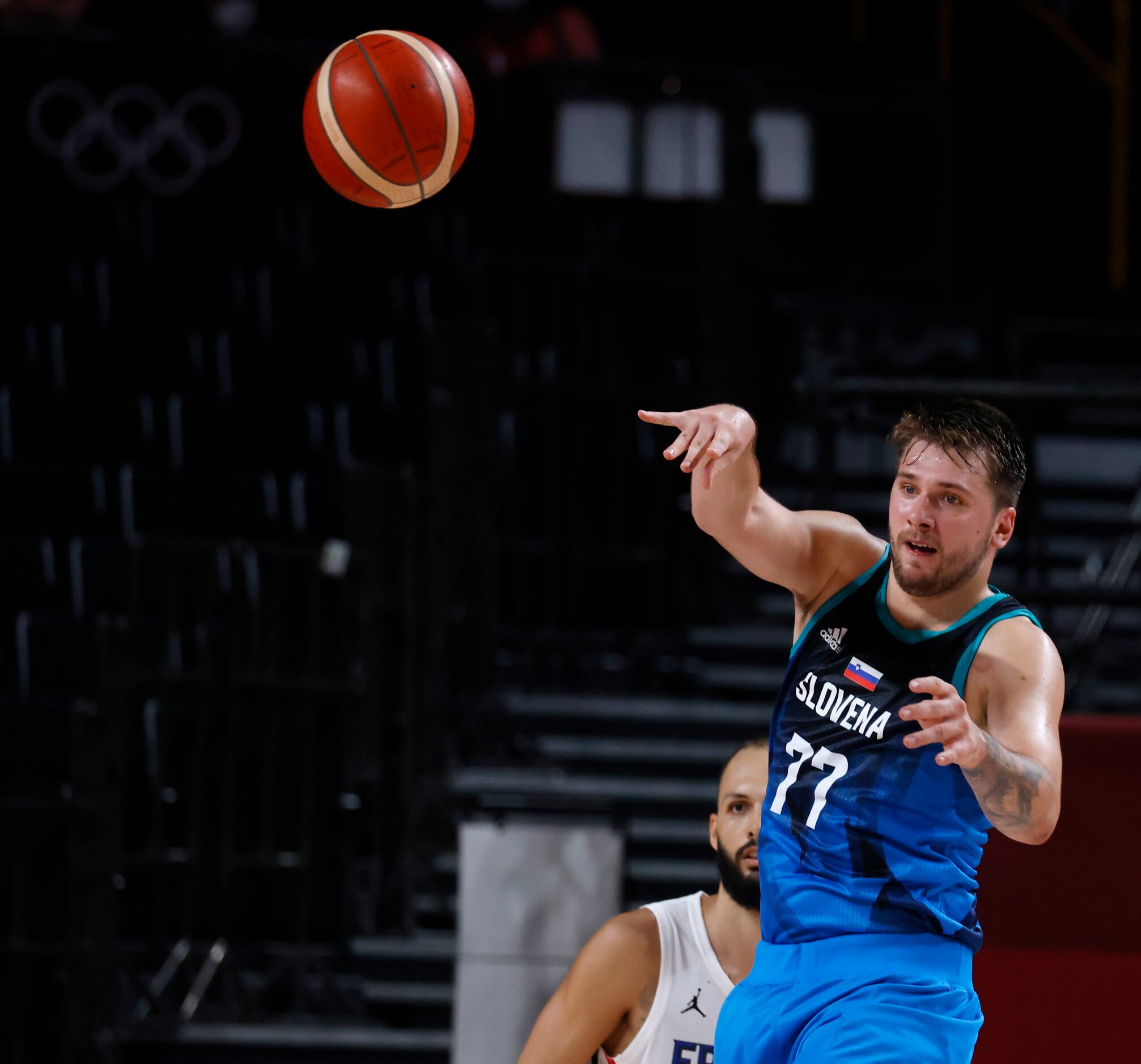 Slovenia’s Luka Doncic (77) attempts a pass in front of France’s Evan Fournier (10) during...