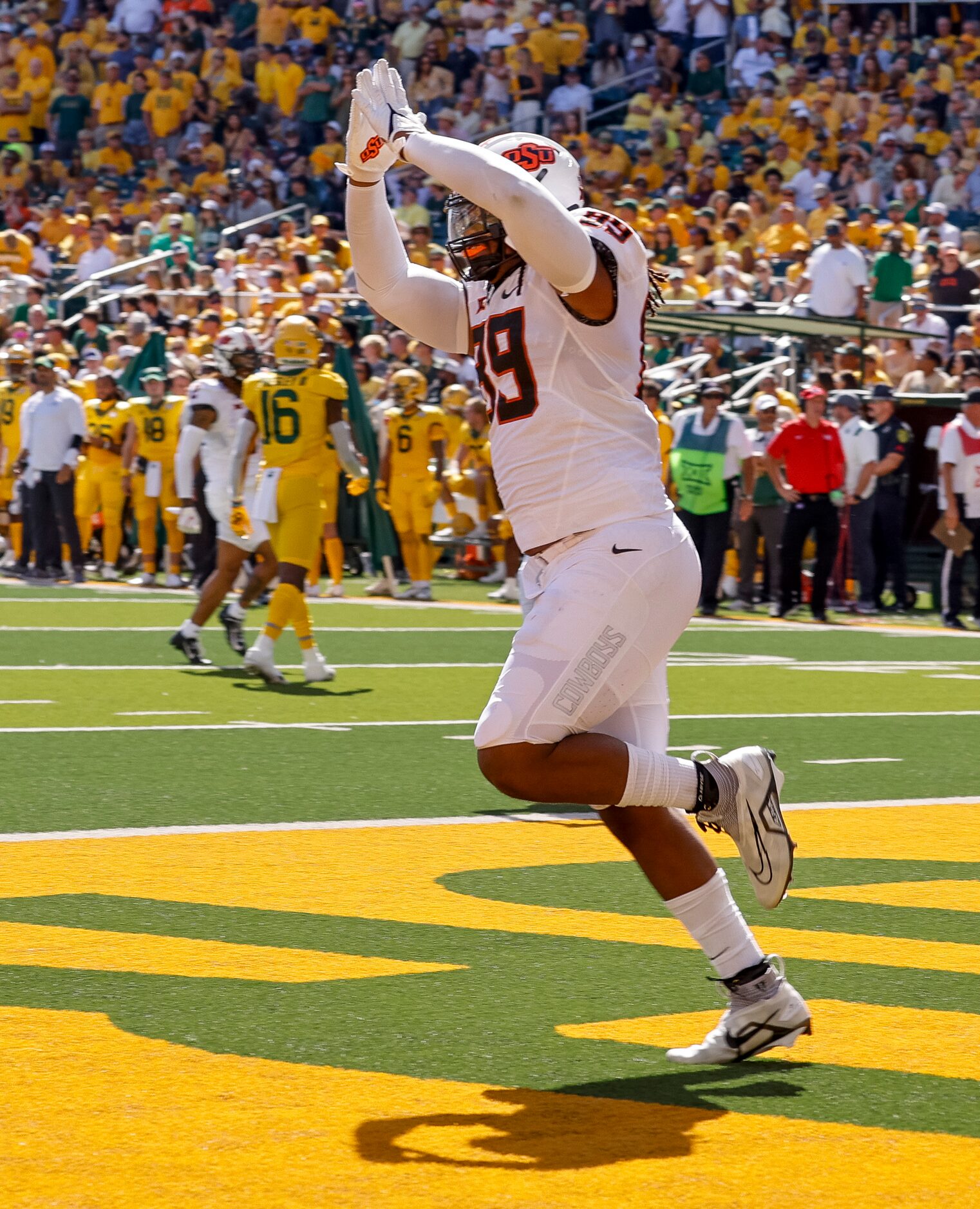 Oklahoma State defensive end Brock Martin (9) celebrates a safety during the second quarter...