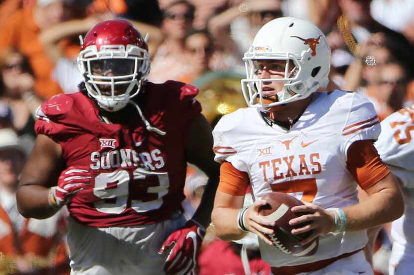 Texas Longhorns quarterback Shane Buechele (7) runs with the ball in the second half during...