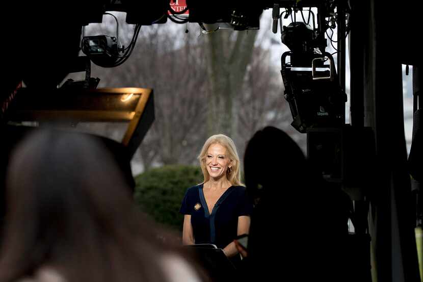 President Donald Trump's adviser Kellyanne Conway gets ready to speak on television outside...