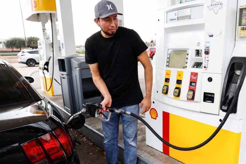 Arturo Hernandez pumps gasoline into his car at Shell on 4611 N US 75-Central Expy 1000 in...