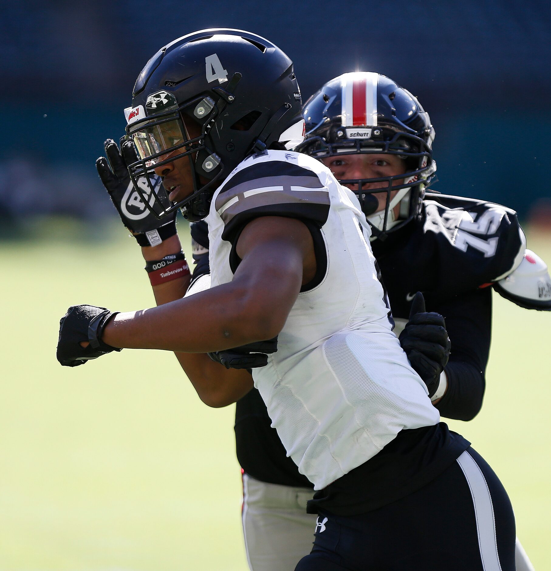 Mansfield Timberview High School defensive end Terrell Tilmon (4) gets past Lovejoy High...