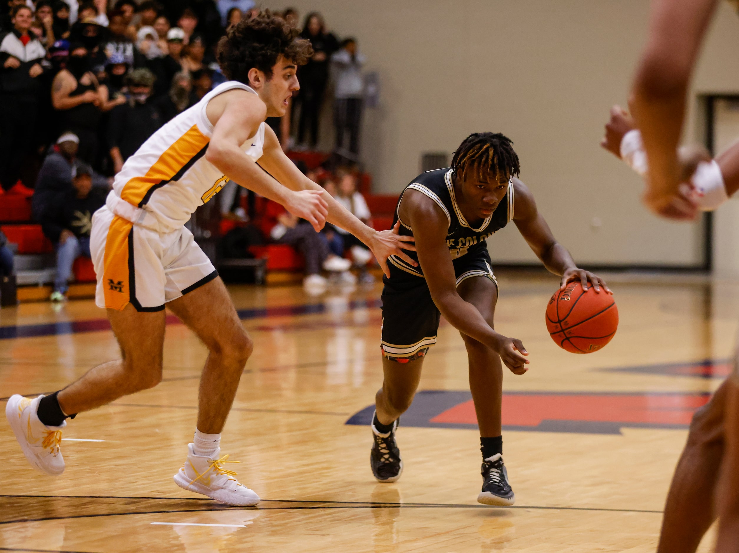 Memorial High School Jaxson Thomas (12) defends The Colony High School Jahyden Davis (0) as...