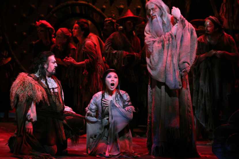 Hei-Kyung Hong (center) performs the role of Liu, flanked by Antonello Palombi (left) and...
