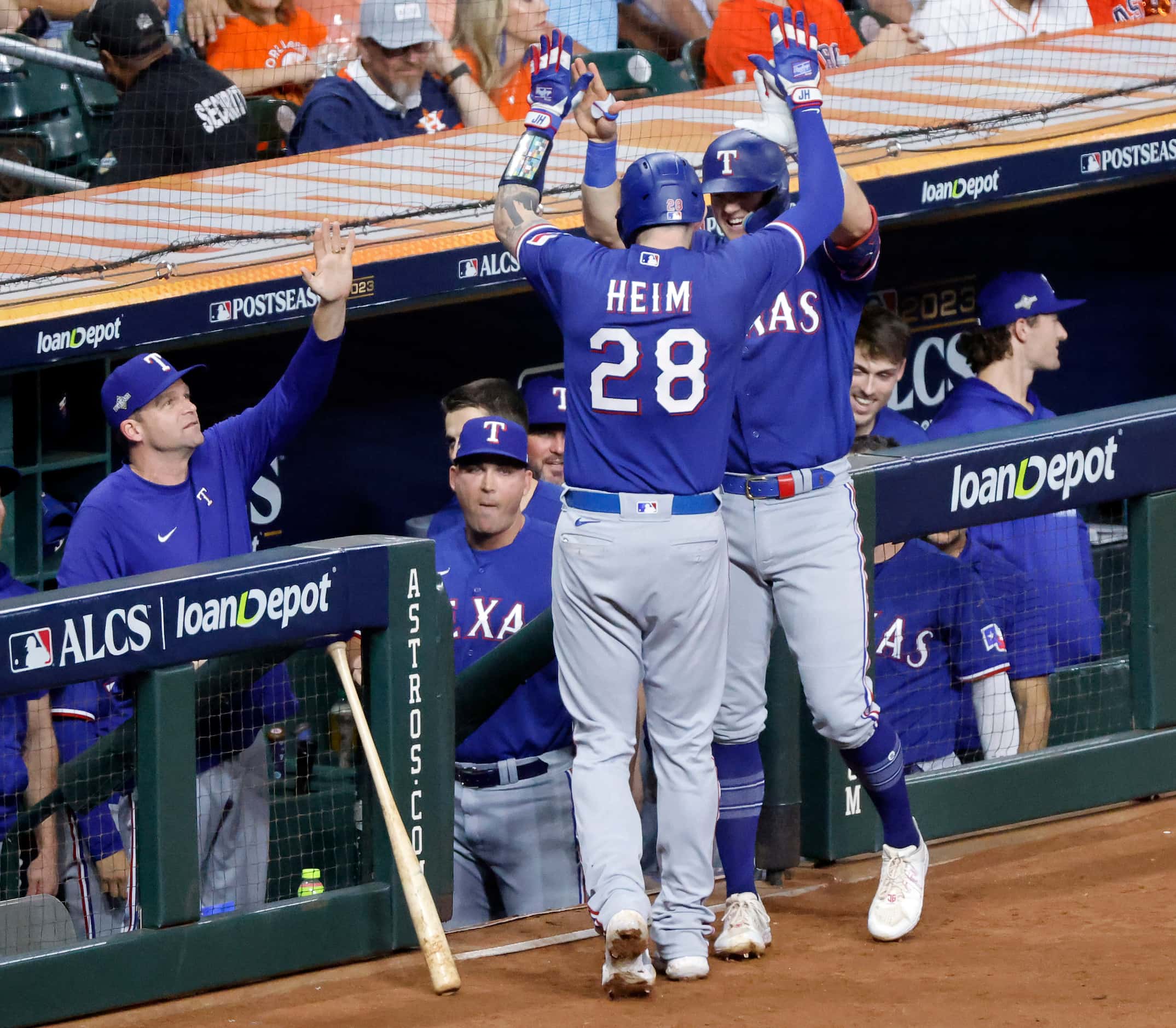 Texas Rangers catcher Jonah Heim (28) is congratulated on his fourth inning, two-run homer...