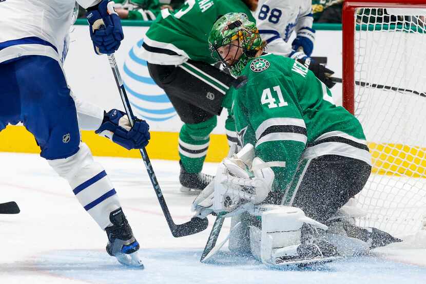 Dallas Stars goaltender Scott Wedgewood (41) stops a shot from Toronto Maple Leafs center...