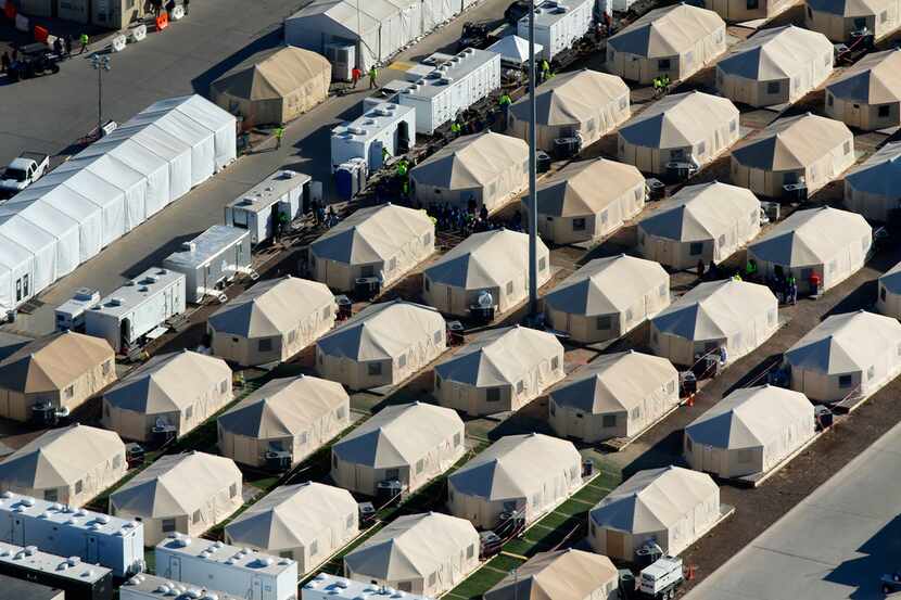 An aerial photo shows the Health and Human Services temporary encampment -- the tent city...