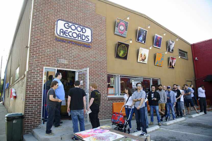 People line up outside of Good Records on Greenville as it celebrates it's 14th year and...