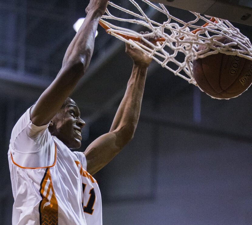 Lancaster's JaKolby Pemberton (11) dunks the ball during the first quarter of their Dallas...