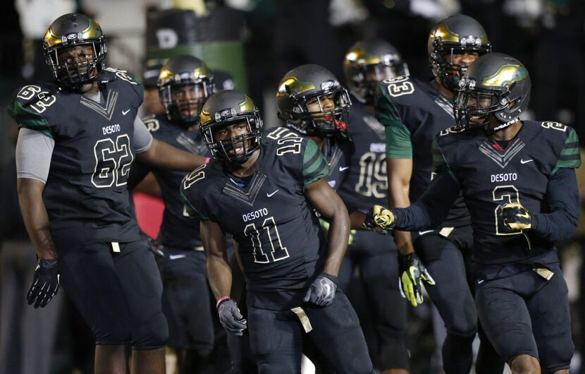 DeSoto wide receiver Kadarrian Nixon (11) celebrates with teammates after a kickoff return...