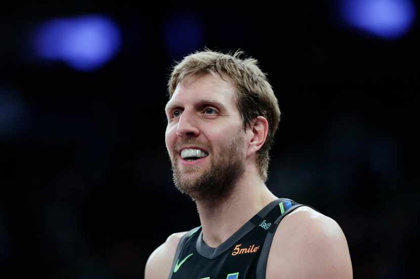 FILE - In this March 13, 2018, file photo, Dallas Mavericks' Dirk Nowitzki smiles during the...