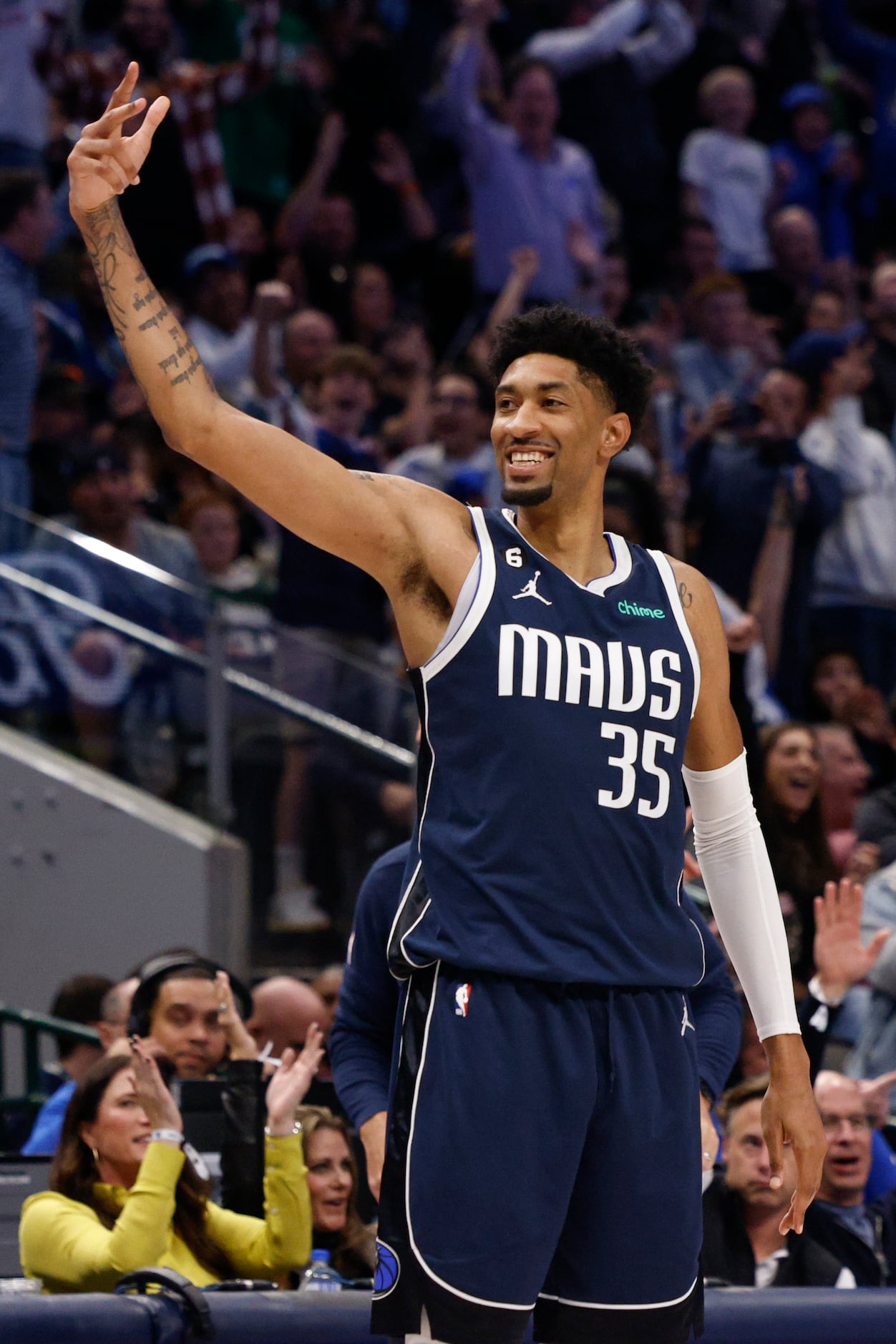 Dallas Mavericks center Christian Wood (35) celebrates after making a three-point shot...