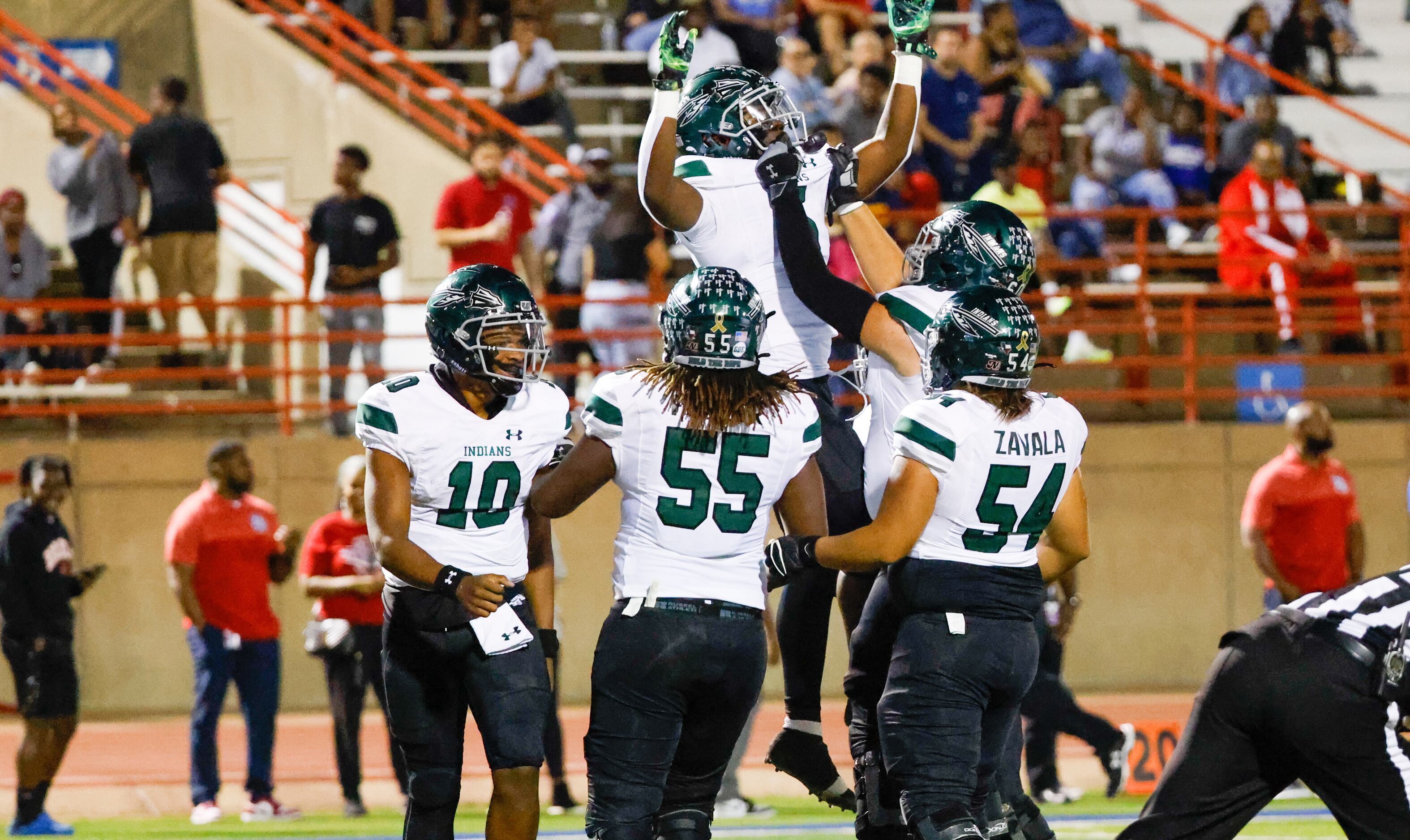 Waxahachie running back Jayden Becks (5) is lifted by teammates in celebration of his...