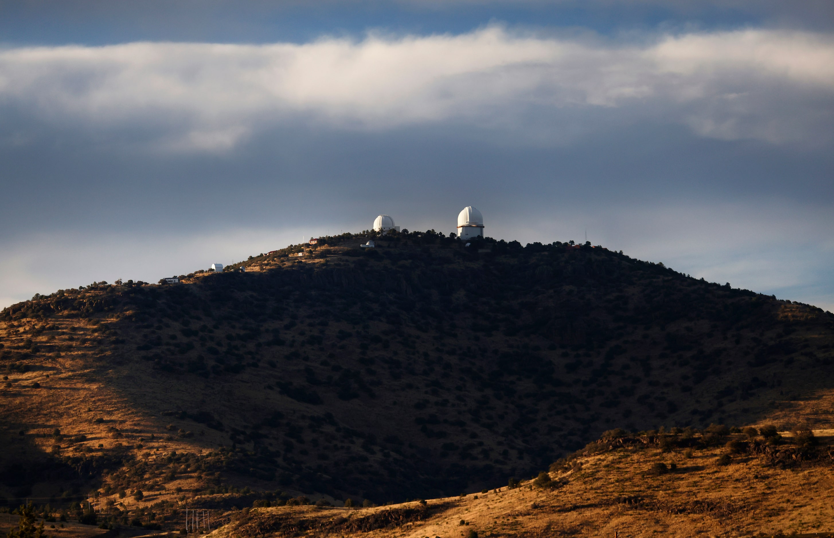 The Harlan J. Smith Telescope (right) and Otto Struve Telescope are seen atop Mount Locke...