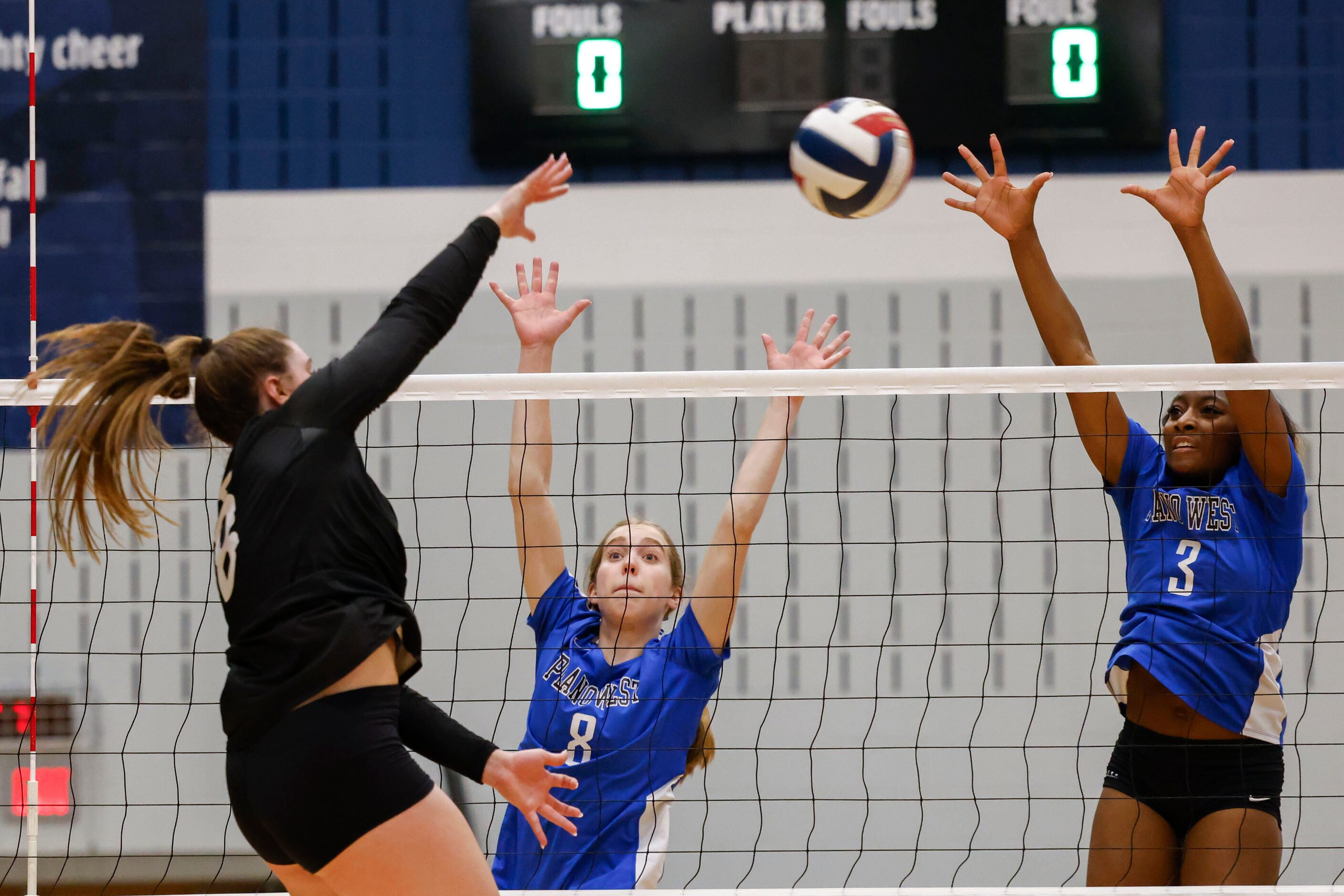 Prosper High’s Reese Renfrow spike the ball against Plano West’s Reese Poerner (8) and...