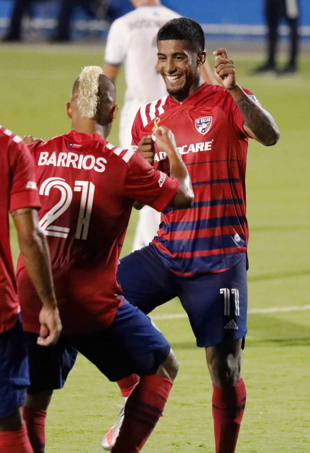 FC Dallas midfielder Santiago Mosquera (11) celebrates his first goal by dancing with FC...