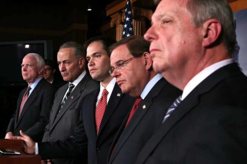 From left: U.S. Sens. John McCain,  Charles Schumer,  Marco Rubio,. Robert Menendez, and...