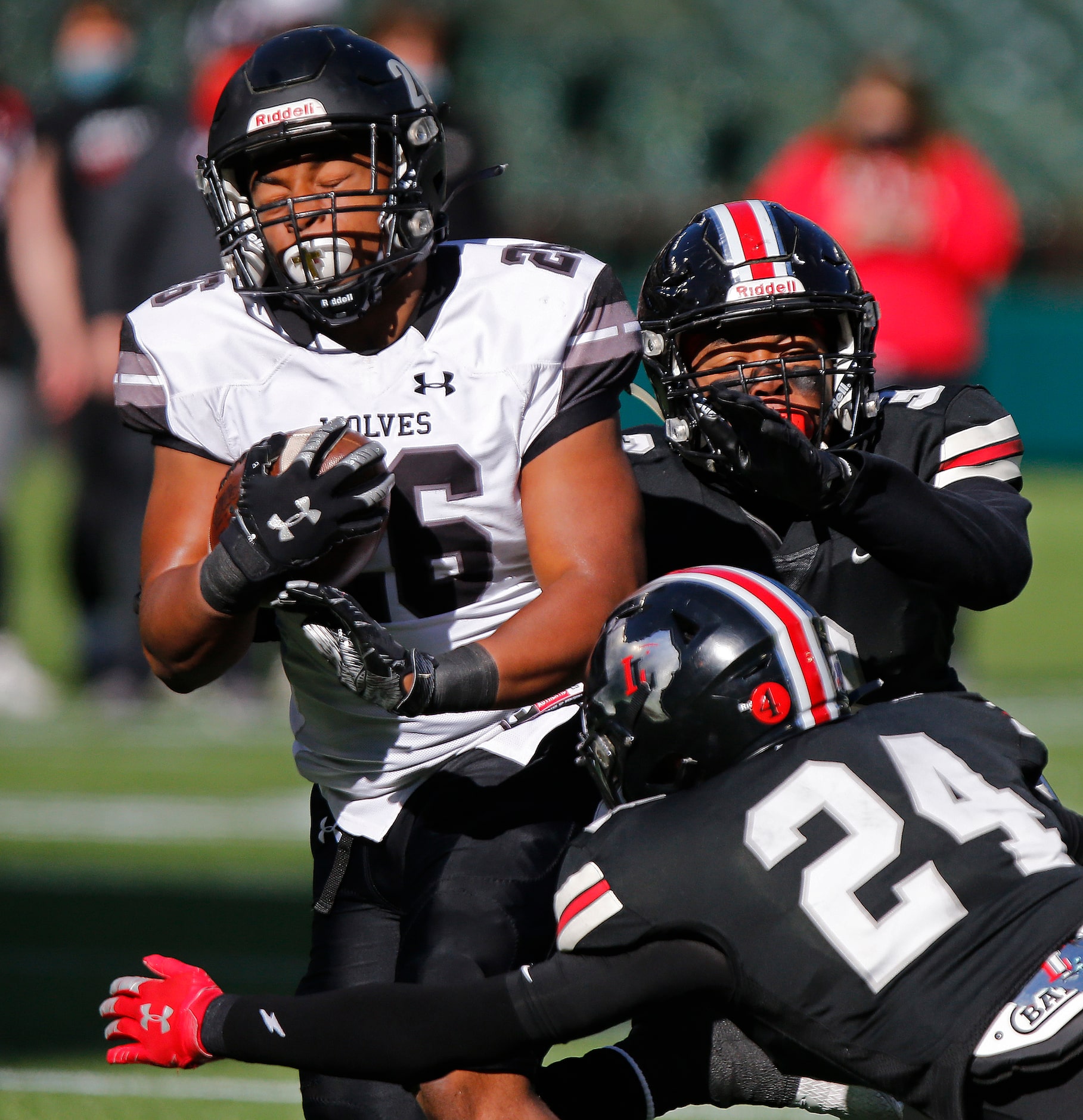 Timberview High School running back Ricky Madison (26) is met by Lovejoy High School...