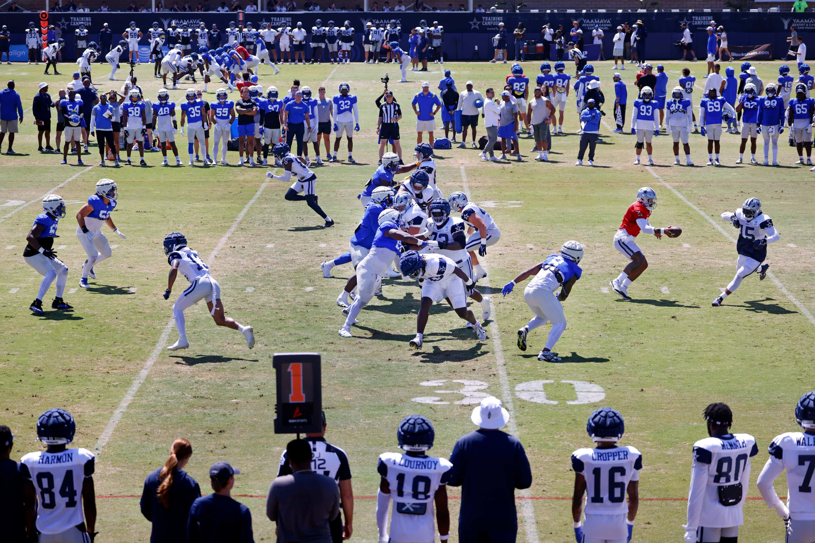 Dallas Cowboys quarterback Dak Prescott (4) fakes the handoff to running back Ezekiel...