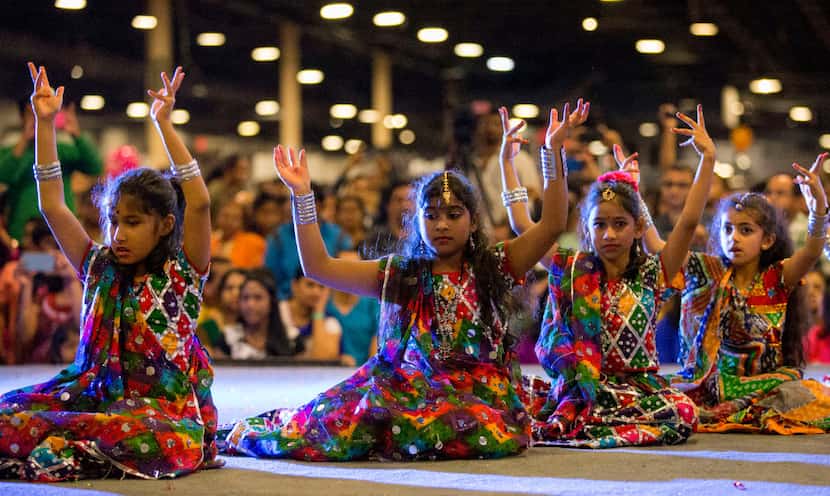 Children in dance teams perform on stage during Diwali Mela at Fair Park in 2016.