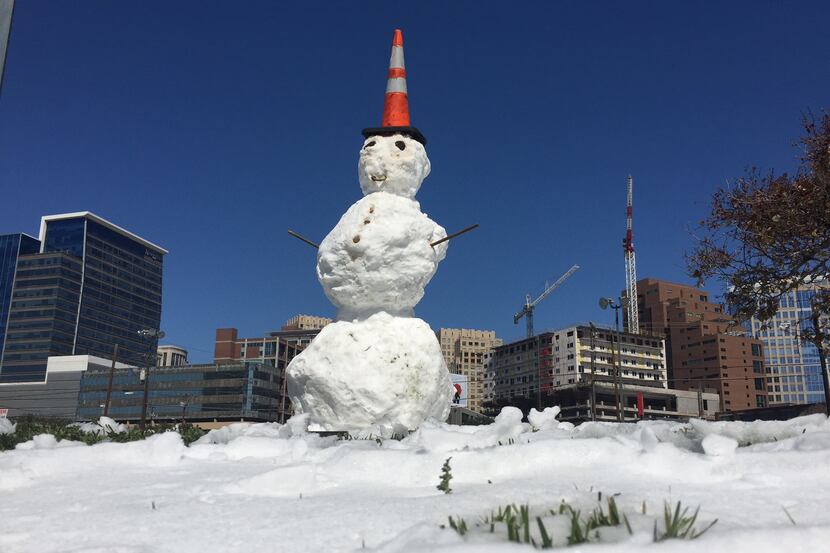A snowman stands at the intersection of Field and Cedar Springs in downtown Dallas.