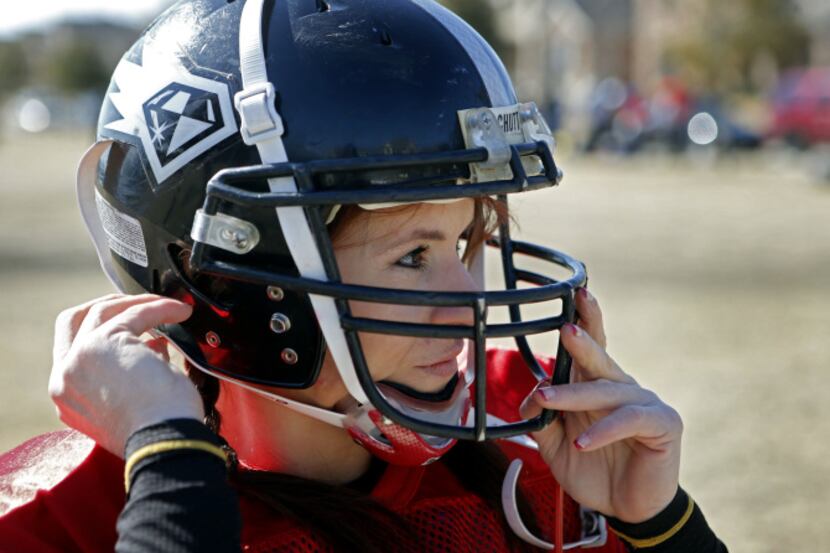 Dr. Jen Welter puts her helmet on before the start of the Texas Revolution practice at...