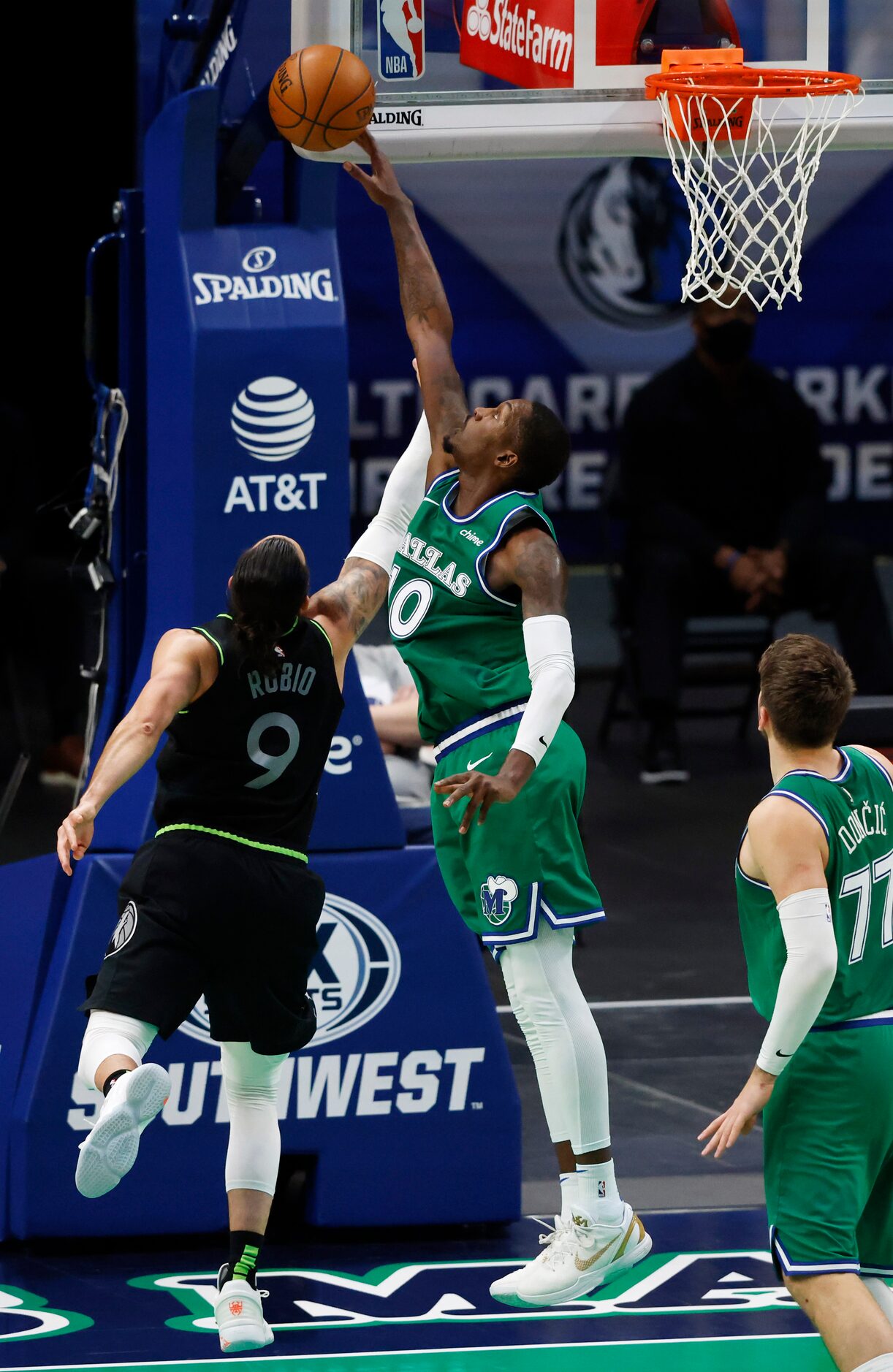 Dallas Mavericks forward Dorian Finney-Smith (10) blocks a shot attempt from Minnesota...